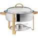 A stainless steel Choice Deluxe round chafer with gold accents and a lid.