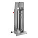 A stainless steel Tre Spade manual vertical sausage stuffer with a cylinder on a metal stand.