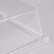 A clear plastic rectangular tray cover on a white surface.