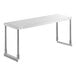 A stainless steel Avantco single deck overshelf on a white rectangular table with metal legs.