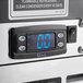 A close up of the digital temperature display on a Perlick Black Glass Froster.