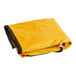 A yellow tarp with a black trim and zipper.