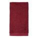 A red 1888 Mills hand towel on a white background.