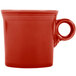 A red Fiesta china mug with a handle.
