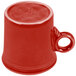 A Scarlet Fiesta china mug with a handle on a white background.