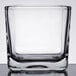 A square clear glass Libbey condiment jar.