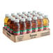 A group of 24 Tropicana Apple Juice plastic bottles in a cardboard box.