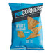 A blue and white bag of Popcorners White Cheddar chips.