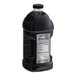 A large black plastic bottle of Lotus Plant Energy Unsweetened Tea Concentrate.