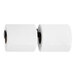 A Bobrick stainless steel double roll toilet tissue holder with two rolls of toilet paper.