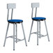 A pair of National Public Seating Titan lab stools with blue seats and silver frames.