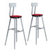 A pair of National Public Seating lab stools with hollyberry red high-pressure laminate seats and backrests.
