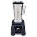 A Waring commercial blender with a silver container and black base.