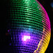A ProX 24" disco ball with colorful lights hanging in a bar.