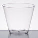 A clear Fineline hard plastic squat tumbler on a white surface.