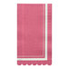 A pink napkin with a white scalloped edge.