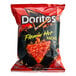 A red bag of Doritos Flamin' Hot Nacho Cheese flavored tortilla chips with a picture of a flaming nacho.