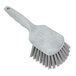 A close-up of a grey Carlisle Sparta utility/pot scrub brush with a handle.