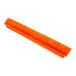 A close-up of a Carlisle Omni Sweep orange push broom head with bristles.