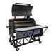 A large black Cajun Custom Cookers Lil-Cajun barbecue grill with a white surface.