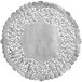 A white doily with a floral design.