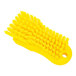 A close-up of a yellow Carlisle Sparta handheld scrub brush with bristles.