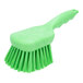 A Carlisle Sparta lime green pot scrub brush with a handle and long bristles.