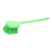 A green Carlisle Sparta utility brush with a long handle.