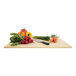 A NoTrax rubber cutting board on a table with vegetables and a knife.