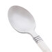 A close up of a WNA Comet Reflections Duet stainless steel plastic teaspoon with a white handle.