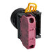 A yellow and pink Estella round push button switch with a black cover.