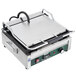 A Waring Tostato Supremo panini grill with a handle and lid.