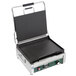 A black Waring panini grill with a smooth top and bottom.