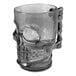 A white plastic skull mug with a handle.