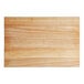 A wooden Choice cutting board with rounded edges.