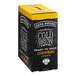 A black and yellow Java House Colombian Cold Brew Coffee bag in a box on a counter.