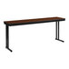 A brown rectangular National Public Seating folding table with black cantilever legs.