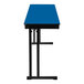 A Persian blue National Public Seating plywood folding table with black legs and a white stripe on the edge.
