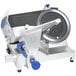 A Vollrath meat slicer with a circular silver blade and blue handle.