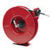 A red Reelcraft hose reel with a black hose attached.