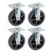 A pack of 4 black Lancaster Table & Seating casters with black rubber wheels.