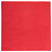 A red paper napkin with a square pattern.