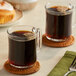 A couple of Lavazza Espresso Italiano coffee mugs on a table.
