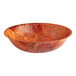 A wooden bowl with a woven circular design.