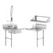 A Regency stainless steel dishtable with two sinks and a faucet.
