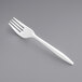 A close-up of a Crystalware white plastic fork.