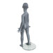 A gray Econoco mannequin standing on a glass table.