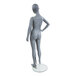 A full shot of an Econoco 10-year-old unisex mannequin standing on a glass base.
