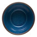 A blue terracotta dip dish with a brown rim.