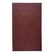 A white rectangular menu cover with a red leather rectangle.